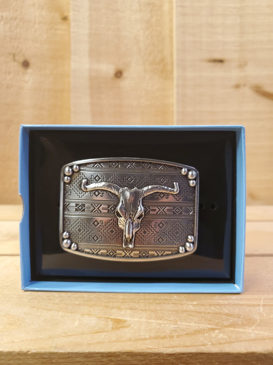 A Southwest Steerhead Belt Buckle by Nocona displayed in an open box, with a steer head design on a brown background.