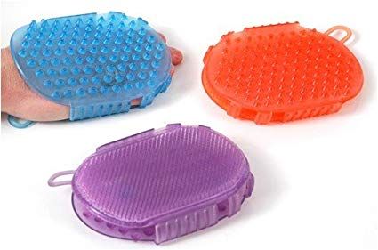blue, orange and purple gel looking rubber grooming tools for horses on a white background
