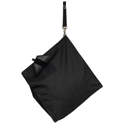 the back of a black slow feed hay bag for horses hanging at a 45 degree angle on a white background