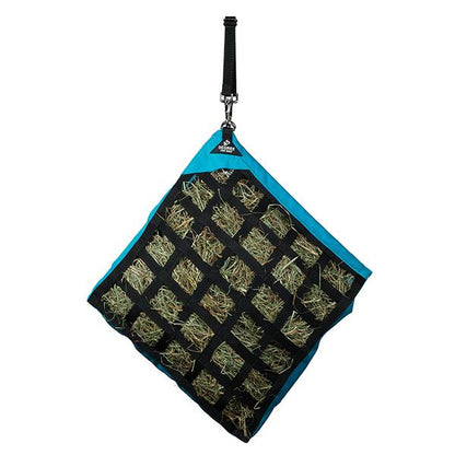 a blue slow feed hay bag for horses hanging at a 45 degree angle on a white background