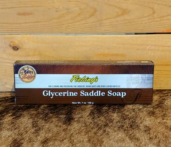 a brown and white box from 'Fiebing's' that says glycerine saddle soap on a wooden background