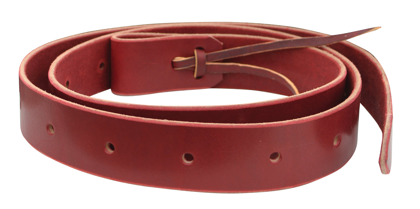 A red latigo leather cinch tie strap with beveled edges and a tapered tip, featuring a lace and holes for adjustment.