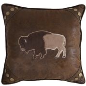 a brown throw pillow with a bison applique on it
