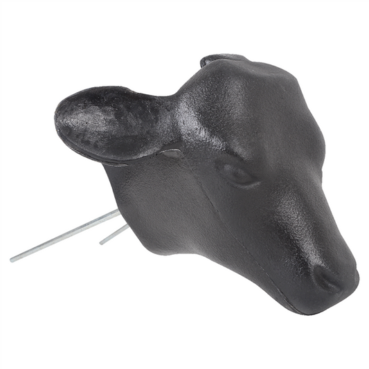 A black molded plastic calf head with two prongs for use with hay bale in calf roping practice.