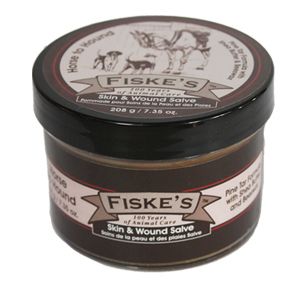 A container of Fiske's Skin & Wound Salve with a label indicating it is a product for animal skin care.