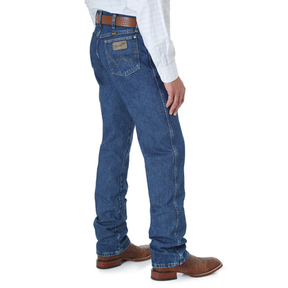 a side view of a man wearing george strait jeans on a white background
